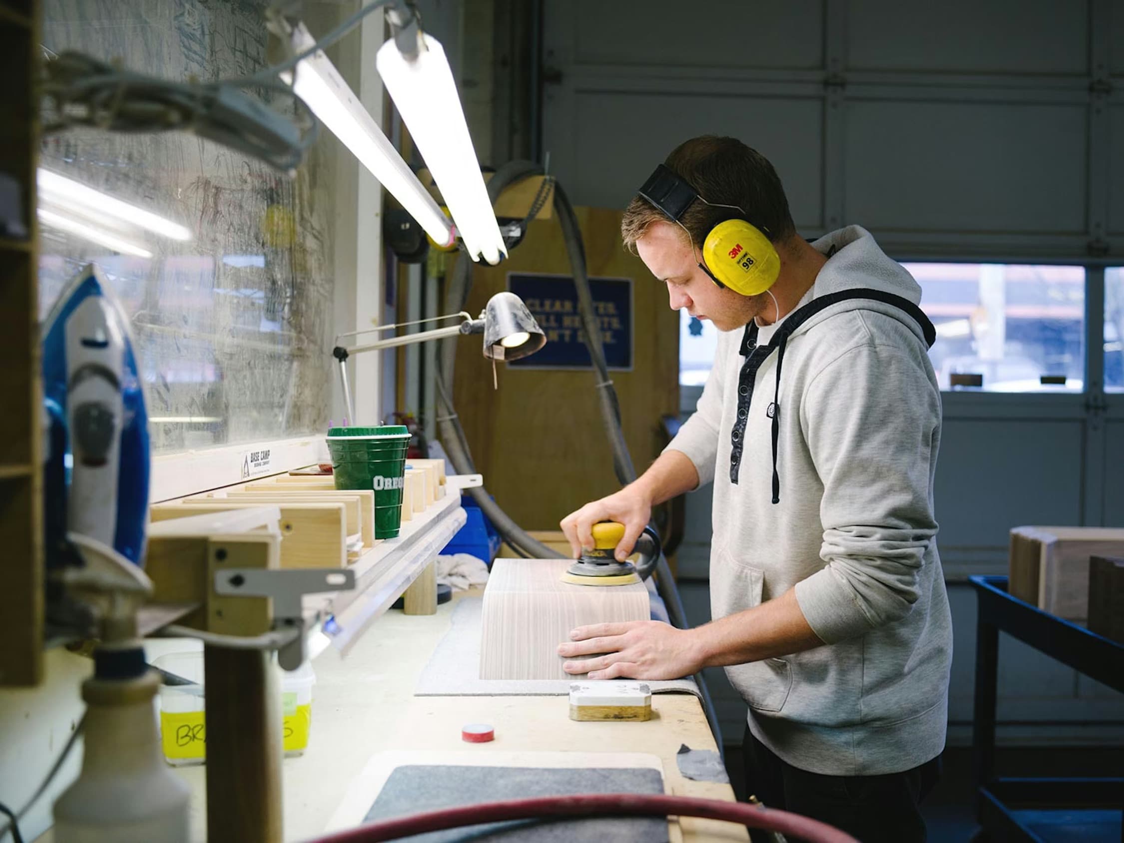 Grovemade walnut desk accessories being assembled in a Portland workshop